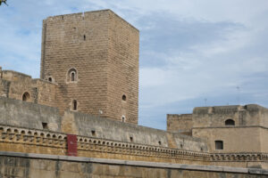 Walls of the Norman Swabian castle of Bari. The gardens with green plants and the fort built by Frederick II. Foto Bari photo.