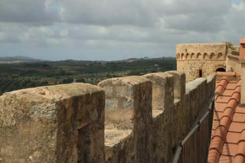 Walls of the town of Magliano in Tuscany. Maremma. 	Path on the castle walls. Landscape with countryside of the hills. - MyVideoimage.com