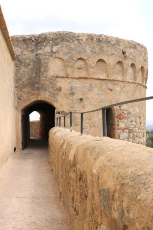 Walls of the town of Magliano in Tuscany. Maremma. 	Path on the castle walls. Landscape with countryside of the hills. - MyVideoimage.com