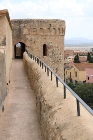 Walls of the town of Magliano in Tuscany. Maremma. 	Path on the castle walls. Landscape with countryside of the hills. - MyVideoimage.com