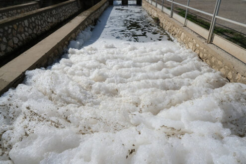 Water pollution. Pollution of a channel caused by surfactants. Stock photos. - MyVideoimage.com | Foto stock & Video footage