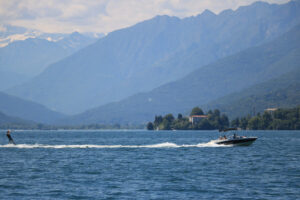 Water skiing on Lake Maggiore. A motorboat pulls a skier on the - MyVideoimage.com