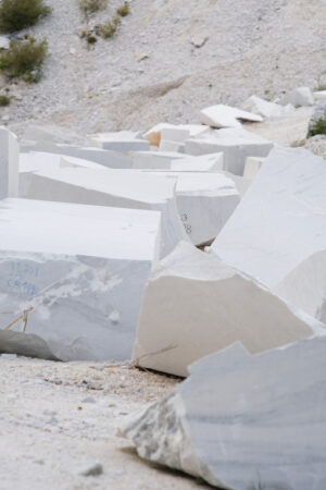 White marble bloks. Blocks of white Carrara marble deposited in a square near the quarries. Stock photos. - MyVideoimage.com | Foto stock & Video footage