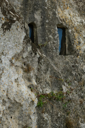 Window in a cave. Window with glass in a cave in the Sassi of Matera. - MyVideoimage.com | Foto stock & Video footage