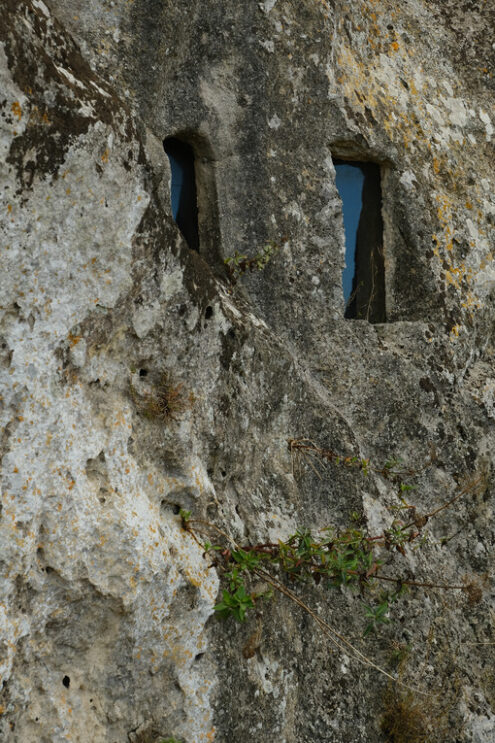 Window in a cave. Window with glass in a cave in the Sassi of Matera. - MyVideoimage.com | Foto stock & Video footage