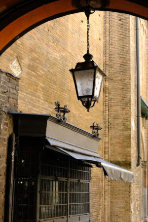 Wrought iron shop shutter and lantern. - MyVideoimage.com | Foto stock & Video footage