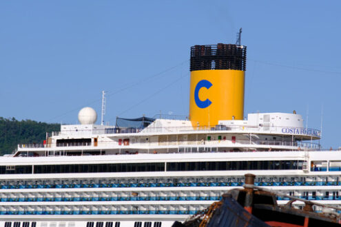 Yellow smokestack and bridges of the cruise ship Costa Fortuna anchored at the Italian port of La Spezia. - LEphotoart.com